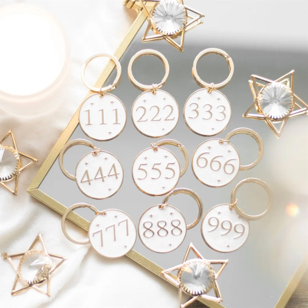Set of 36 Angel Number Keyrings on Display - Image 5